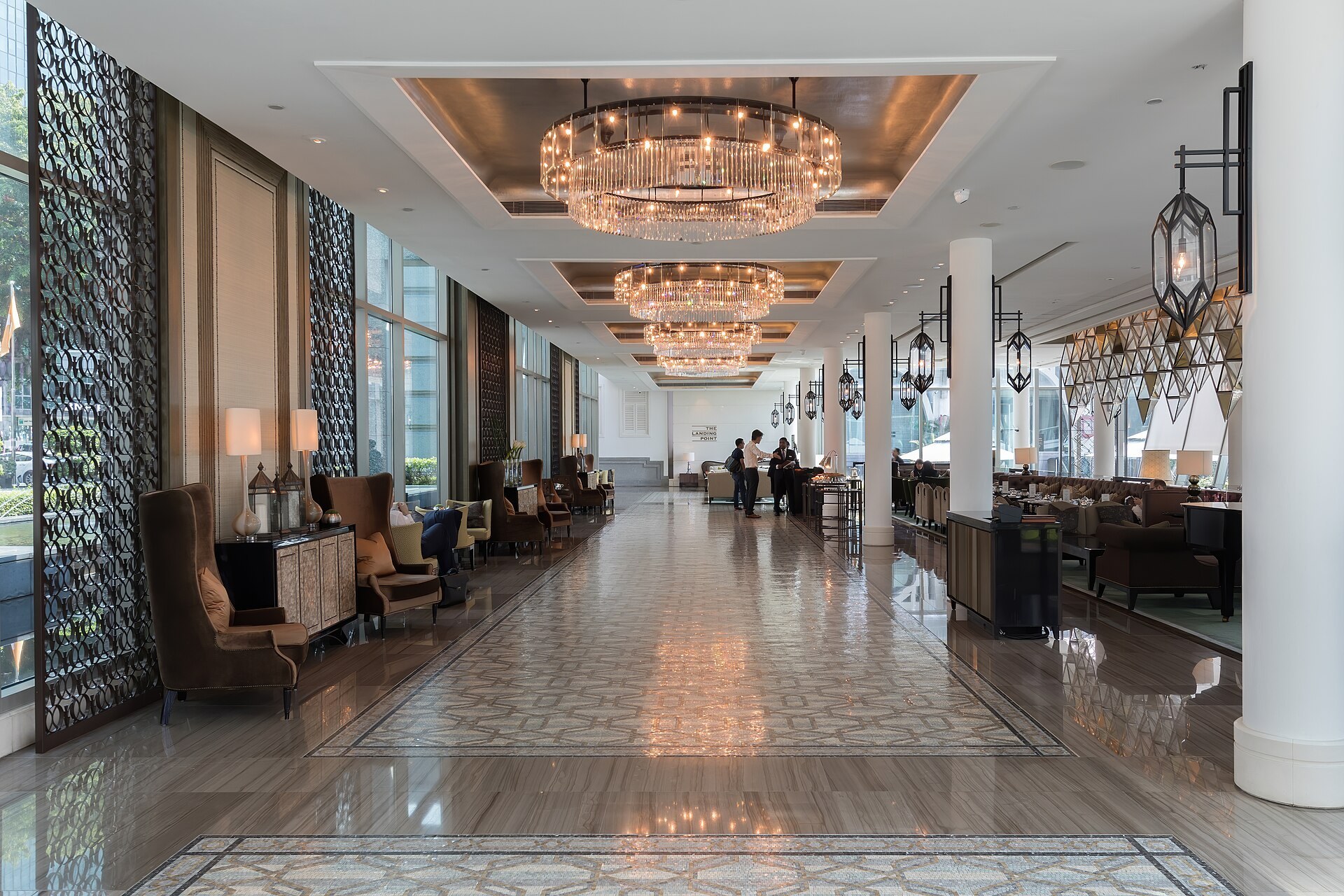 A hotel lobby lounge laid for quiet conversation
